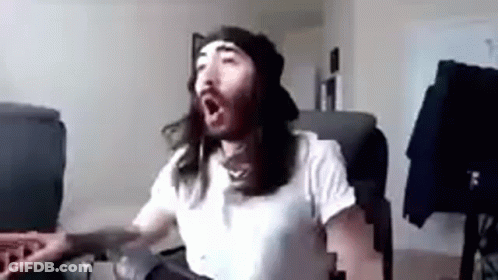 Man With Long Hair And Beard Yawning GIF