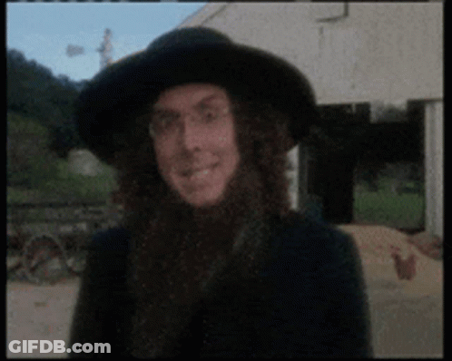 Man With Long Hair And Black Hat Smiling GIF