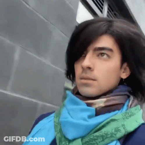 Man With Long Hair And Blue Scarf GIF