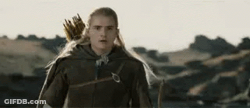 Man With Long Hair And Bow And Arrow In Field GIF