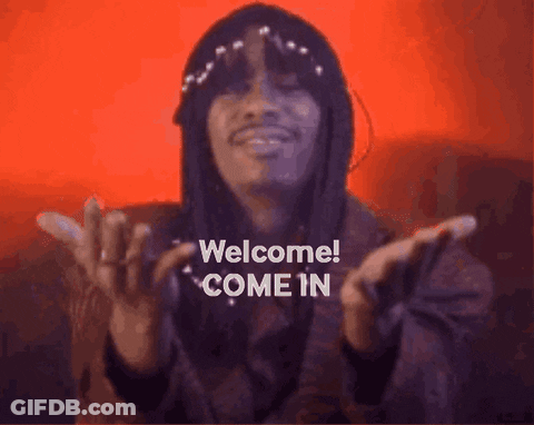 Man With Long Hair And Hat Saying Welcome GIF