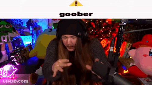 Man With Long Hair And Headphones Making Funny Face At Microphone GIF