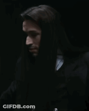 Man With Long Hair And Him In Red GIF
