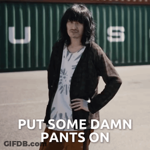 Man With Long Hair And Mustache By Green Container Saying USS GIF