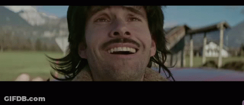 Man With Long Hair And Mustache Smiling GIF