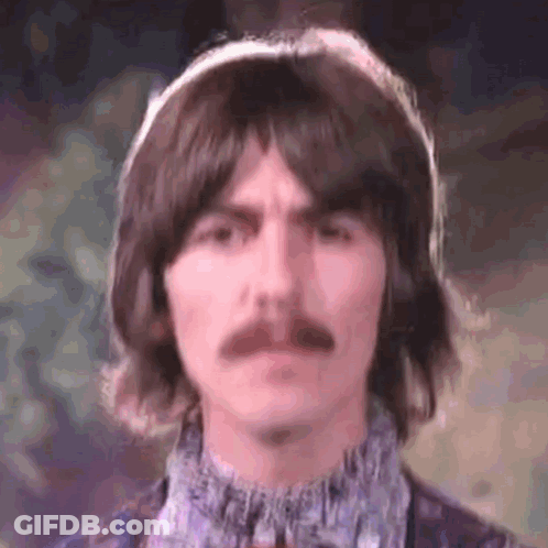 Man With Long Hair And Mustache Wearing Headphones GIF