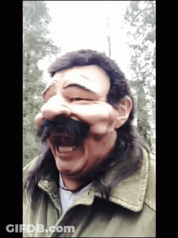 Man With Long Hair And Mustache Wears Mask GIF