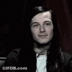 Man With Long Hair And Neck Tattoo Smiling GIF