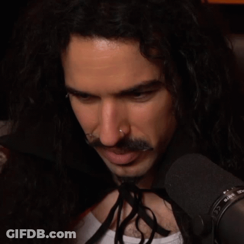 Man With Long Hair And Nose Ring At Microphone Saying Rode GIF