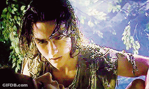 Man With Long Hair And Snake Around Neck Looking At Woman GIF