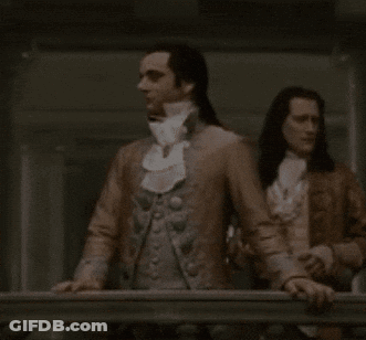 Man With Long Hair And White Tie Standing GIF