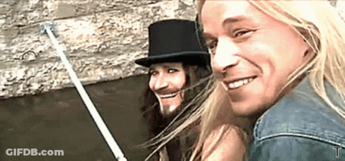 Man With Long Hair, Beard, And Top Hat GIF