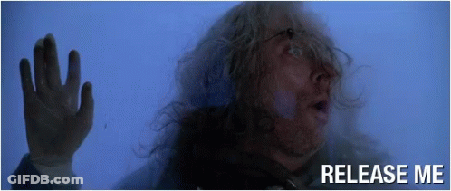 Man With Long Hair Behind Glass Saying Release Me GIF