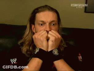 Man With Long Hair Covering Mouth Watching Sky Sports GIF