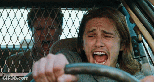 Man With Long Hair Driving Car Mouth Open GIF