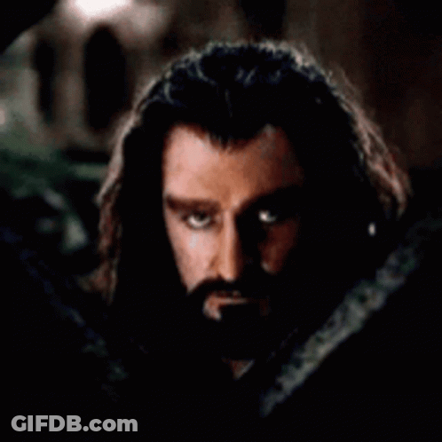 Man With Long Hair Hiding Face Behind Snake GIF