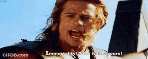 Man With Long Hair Holding Hammer Screaming Immortality GIF