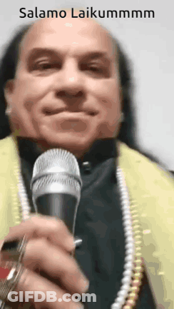 Man With Long Hair Holding Microphone GIF