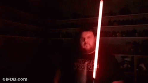Man With Long Hair Holding Red Lightsaber GIF