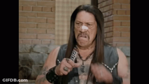 Man With Long Hair Holding Snickers Bar GIF