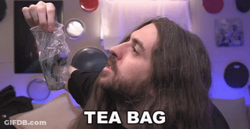 Man With Long Hair Holding Tea Bag GIF