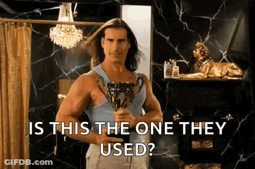 Man With Long Hair Holding Trophy GIF