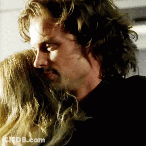 Man With Long Hair Hugging Woman GIF
