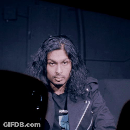Man With Long Hair In Black Jacket Saying Nothing GIF