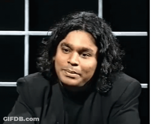 Man With Long Hair In Black Shirt GIF