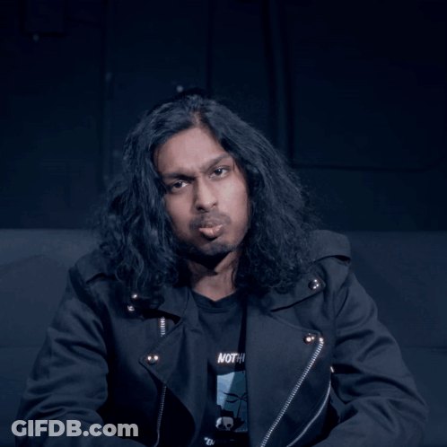 Man With Long Hair In Black Shirt Saying Nothing GIF
