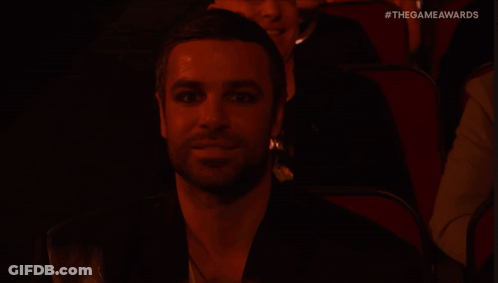 Man With Long Hair In Black Shirt Says Nothing GIF