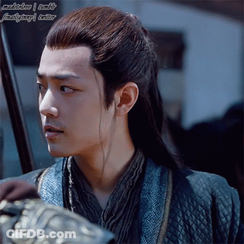 Man With Long Hair In Blue Jacket And Scarf GIF