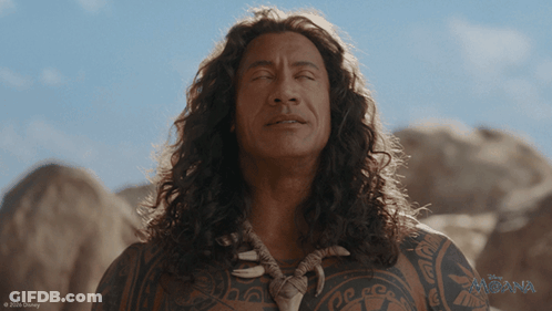 Man With Long Hair In Front Of Disney Moana Poster GIF