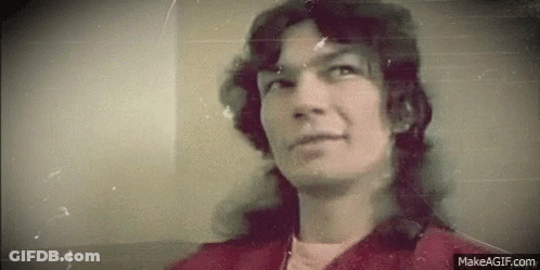 Man With Long Hair In Red Jacket GIF