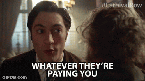 Man With Long Hair In Suit And Tie Making Funny Face GIF