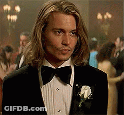 Man With Long Hair In Tuxedo And Bow Tie GIF