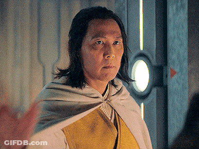 Man With Long Hair In White Cape GIF