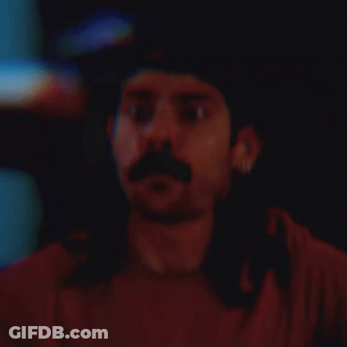 Man With Long Hair Mustache Baseball Cap Earrings GIF