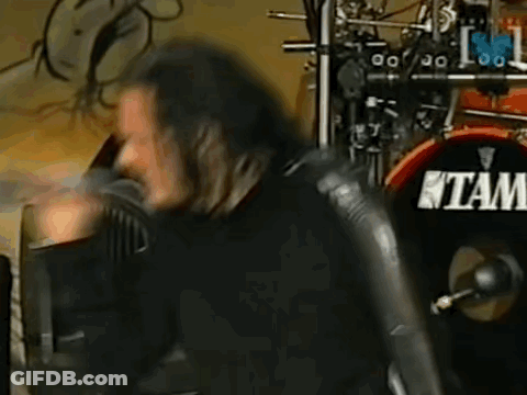 Man With Long Hair Playing Drums Saying Tam GIF