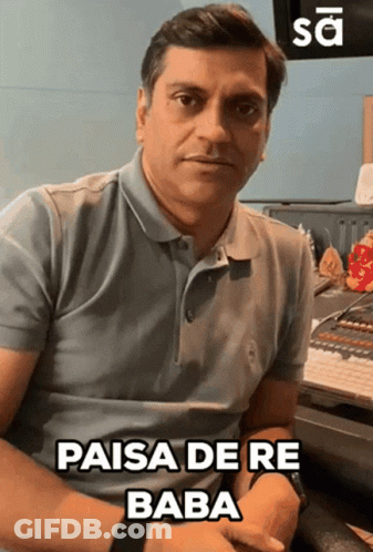Man With Long Hair Playing Flute In Front Of TV Saying Play GIF