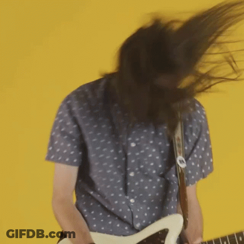 Man With Long Hair Playing Guitar GIF