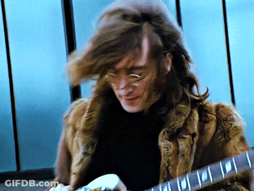 Man With Long Hair Playing Guitar GIF