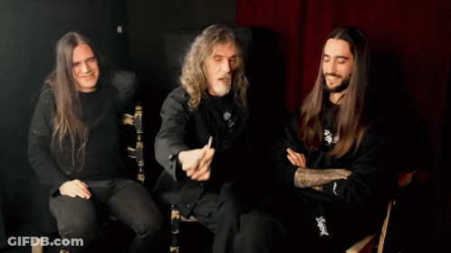Man With Long Hair Pointing At Camera Wearing Slayer Shirt GIF