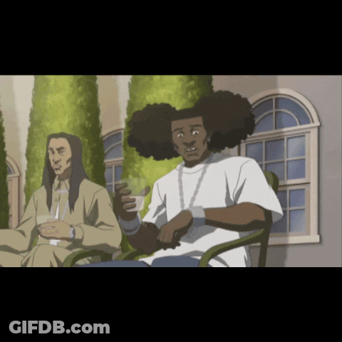 Man With Long Hair Sits Next To Another Man GIF