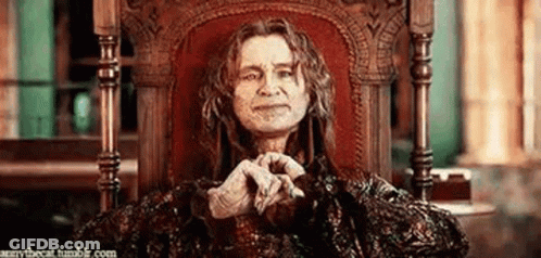 Man With Long Hair Sitting With Hands Folded In Prayer GIF
