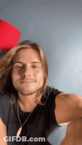 Man With Long Hair Wearing Black Shirt GIF