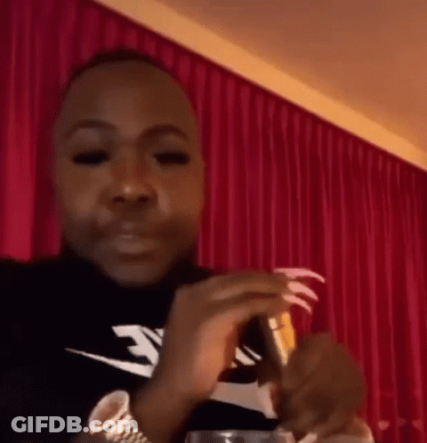 Man With Long Nails Holding Wine GIF