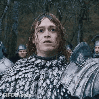 Man With Long Red Hair In Armor And Helmet GIF