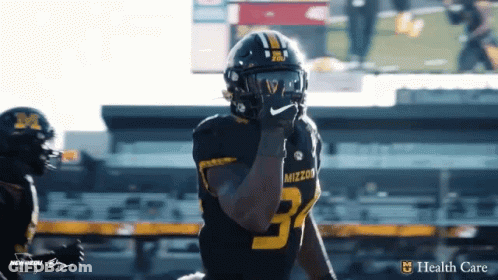 Man With M On Chest GIF
