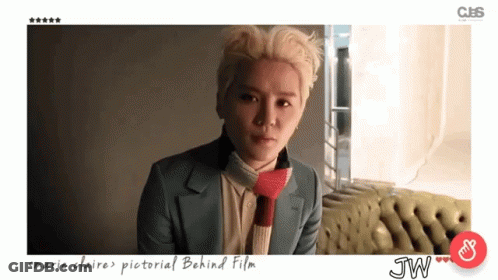 Man With Marie Claire Pictorial Behind Film GIF